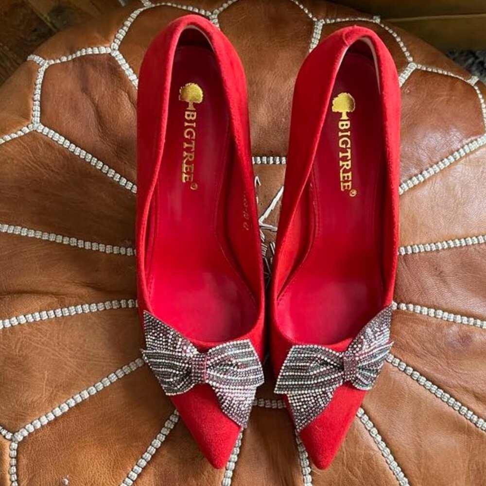 Red pumps with diamante bow detail